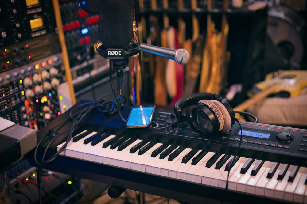 Microphone and keyboard used to track vocals and instrument parts